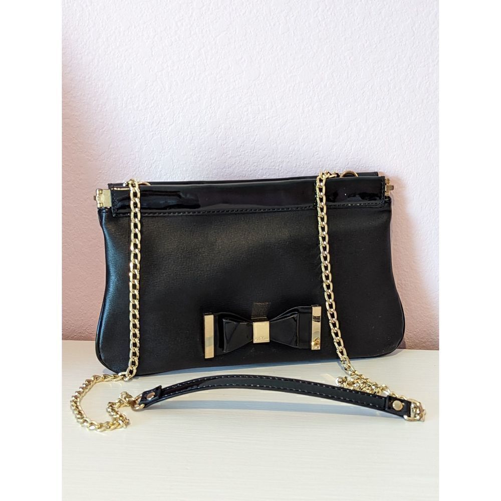 Lulu by Guinness, elegant black shoulder bag or clutch.